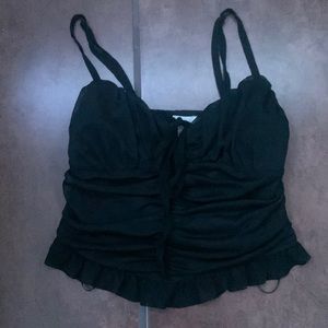 A black stretchy crop top from Meraki